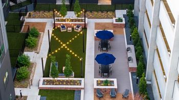 Interactive courtyard with outdoor gas grills and outdoor games